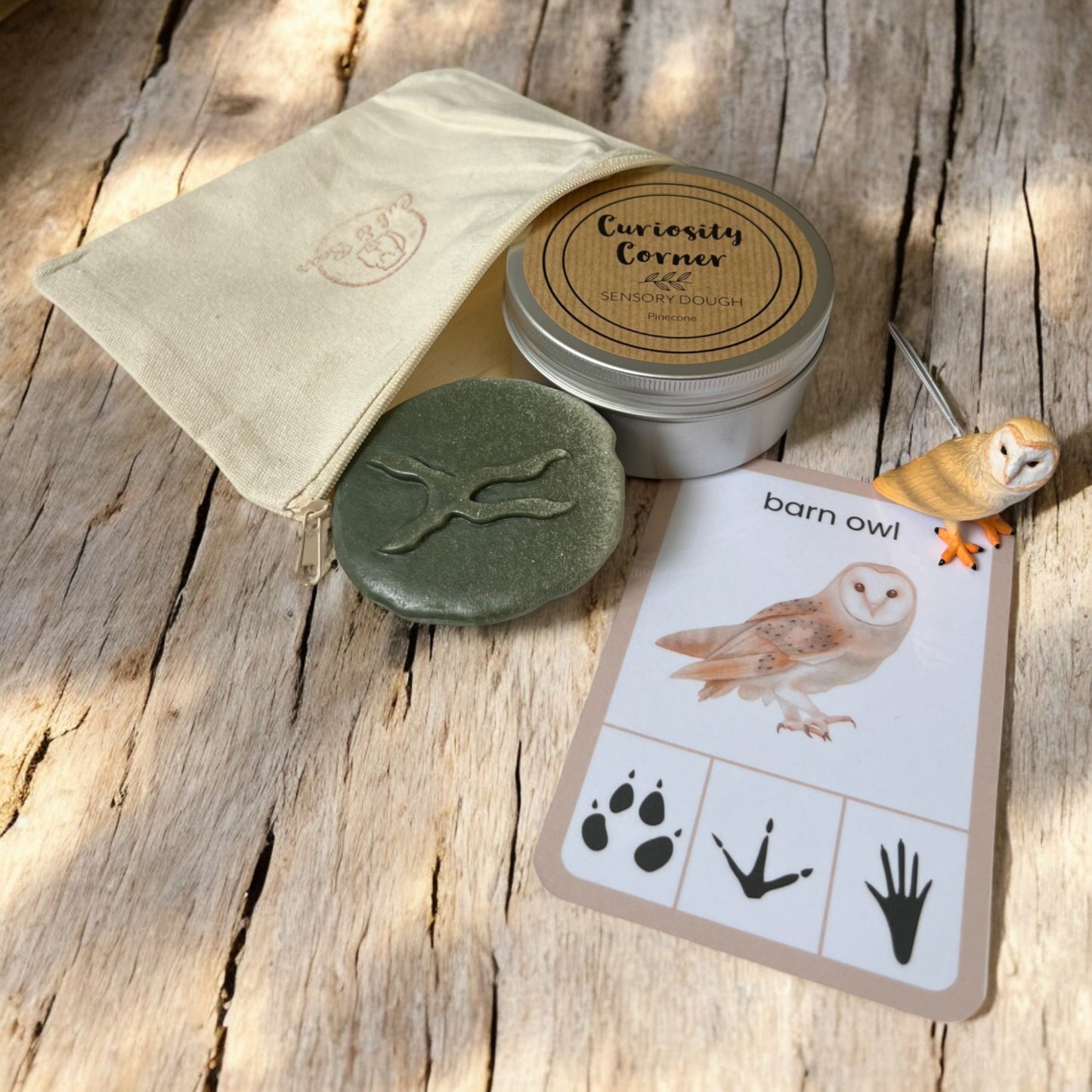 Cub & Bear Discovery Pouch containing Mojo Barn Owl, Curiosity Corner Dough, Yellow Door Let's Investigate stone, & PlayCraftGrow Flashcard