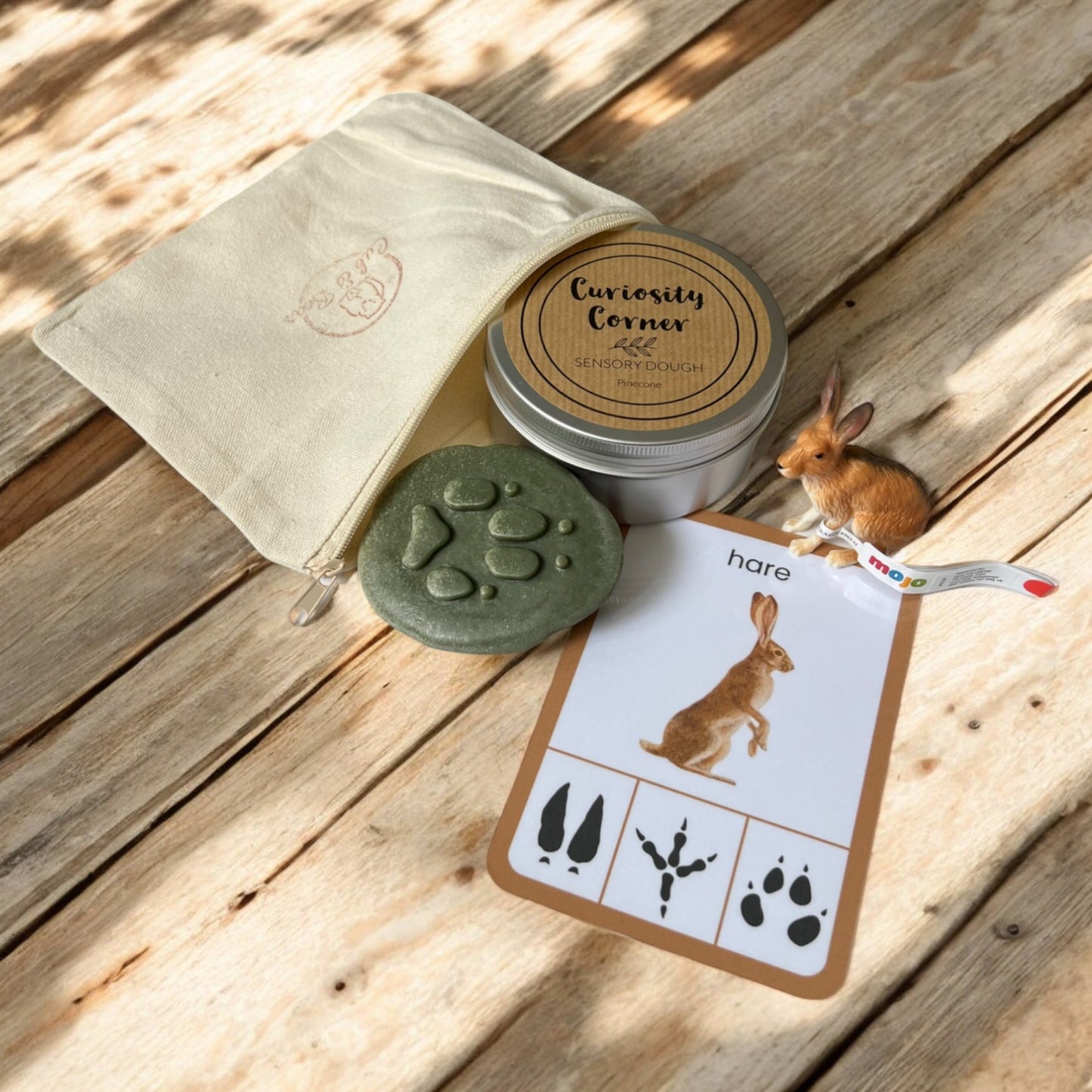 Cub & Bear Discovery Pouch containing Mojo European Hare, Curiosity Corner Dough, Yellow Door Let's Investigate stone, & PlayCraftGrow Flashcard