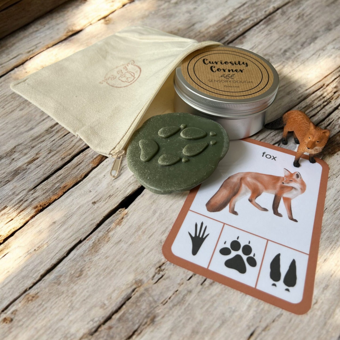 Cub & Bear Discovery Pouch containing Mojo Red Fox, Curiosity Corner Dough, Yellow Door Let's Investigate stone, & PlayCraftGrow Flashcard